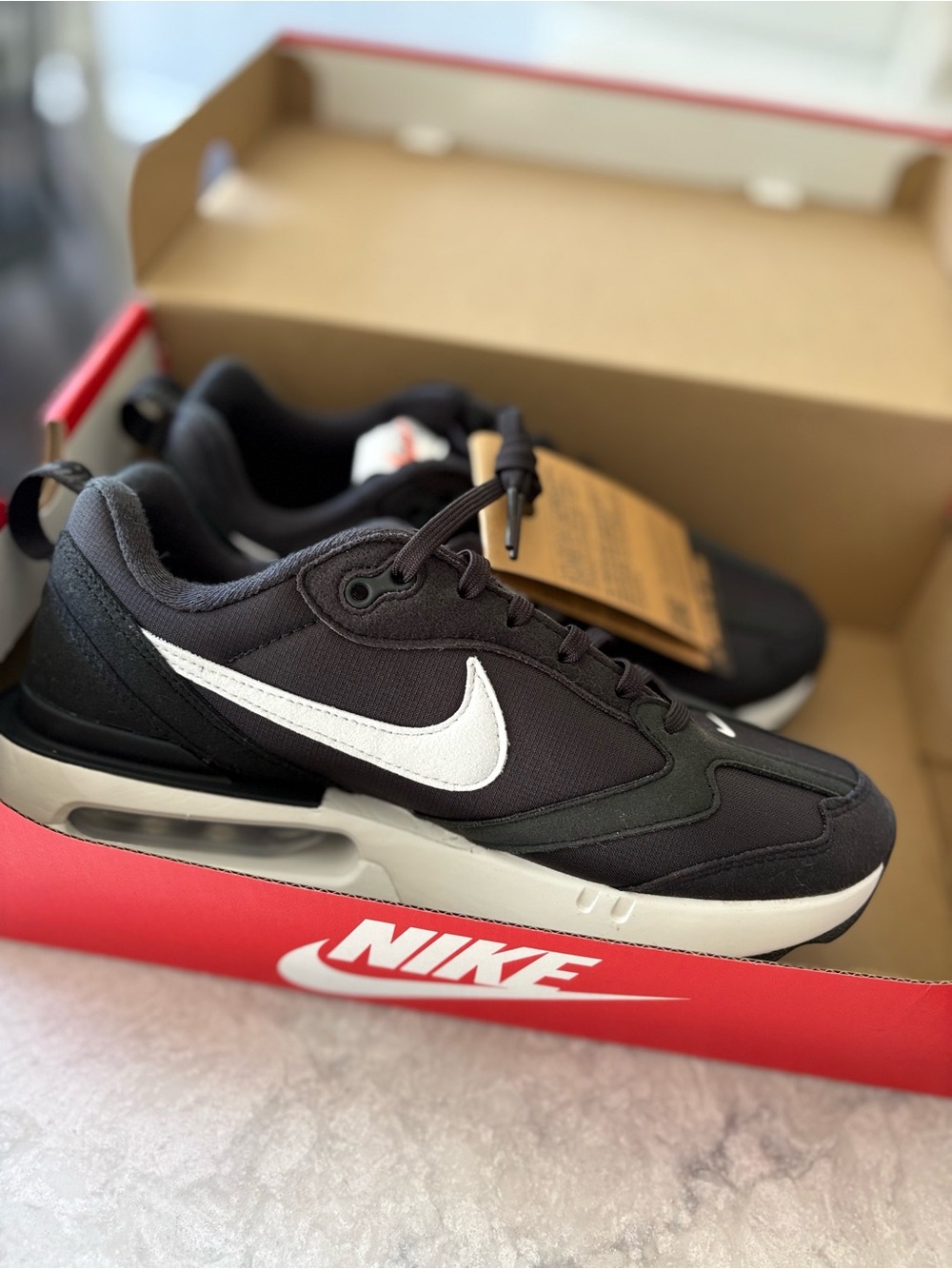 Nike Women's Black and White Air-Cushioned Athletic Sneakers